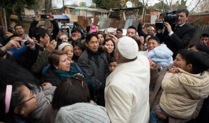 epa04609932 A handout picture provided by Vatican newspaper Osservatore Romano shows Pope Francis being greeted during a visit to a refugee camp in Rome, Italy, 08 February 2014.  EPA/OSSERVATORE ROMANO / HANDOUT  HANDOUT EDITORIAL USE ONLY/NO SALES