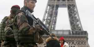 French soldier patrol near the Eiffel Tower in Paris as part of the highest level of "Vigipirate" security plan after a shooting at the Paris offices of Charlie Hebdo January 9, 2015. The two main suspects in the weekly satirical newspaper Charlie Hebdo killings were sighted on Friday in the northern French town of Dammartin-en-Goele where at least one person had been taken hostage, a police source said. REUTERS/Gonzalo Fuentes (FRANCE - Tags: MILITARY CRIME LAW POLITICS)
